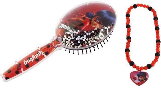 Spazzola miracoloso e Collier