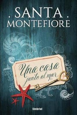 Una casa junto al mar - Santa Montefiore - cover